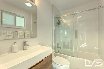 a bathroom with a shower and a toilet and a sink at Cascada-Luxe Resort Heated Pool HotTub Wlk 2 Beach in Fort Lauderdale