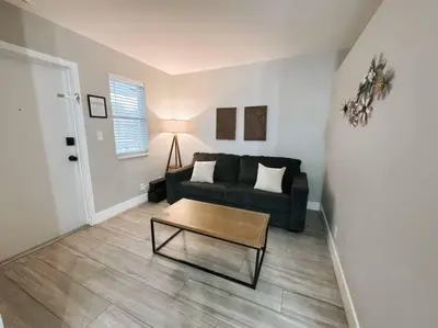 a living room with a couch and a coffee table at Rustic Retreats Modern 1BR for 4 guests in the heart of Fort Lauderdale in Fort Lauderdale