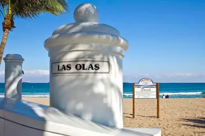 a large white object on the beach with a sign at Rustic Retreats Modern 1BR For 4 Guests Minutes From Las Olas in Fort Lauderdale