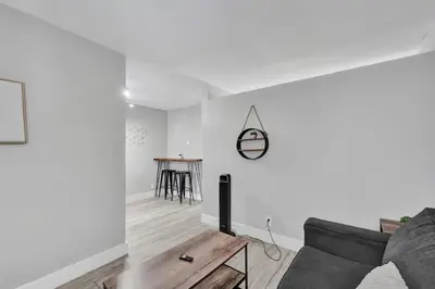 a living room with a couch and a table at Rustic Retreats Cozy 1BR For 4 Guests Minutes From Las Olas in Fort Lauderdale