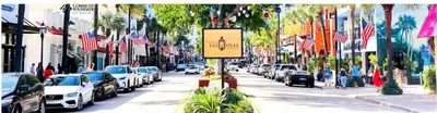 a street with cars parked on the side of the road at Rustic Retreats Cozy 1BR For 4 Guests In The Heart Of Fort Lauderdale in Fort Lauderdale