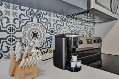 a coffee maker on a counter in a kitchen at Rustic Retreats Cozy 1BR For 4 Guests In The Heart Of Fort Lauderdale in Fort Lauderdale