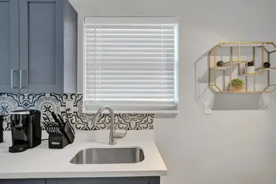 a kitchen with a sink and a window at Rustic Retreats Beachy 1BR for 4 guests in the heart of Fort Lauderdale in Fort Lauderdale