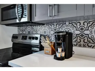 a kitchen with a counter top with a coffee maker at Rustic Retreats Modern 1BR for 2 guests in the heart of Fort Lauderdale in Fort Lauderdale