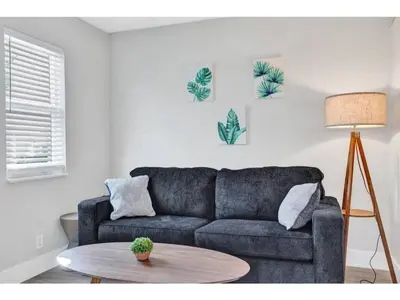 a living room with a couch and a table at Rustic Retreats Beachy 1BR for 4 guests in the heart of Fort Lauderdale in Fort Lauderdale