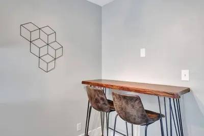 a table and two chairs in a room at Rustic Retreats Beachy 1BR for 4 guests in the heart of Fort Lauderdale in Fort Lauderdale