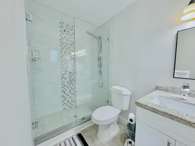 a bathroom with a shower and a toilet and a sink at Private Pool Villa Tropical Retreat Near Beach in Fort Lauderdale