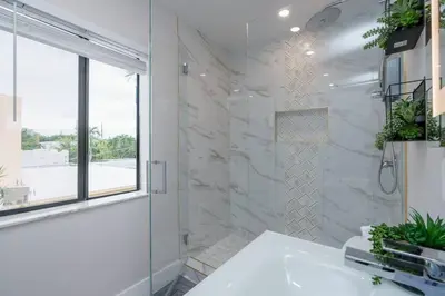 a white bathroom with a shower and a sink at New! Miami & Calle Ocho Simpson's Funhouse! in Miami