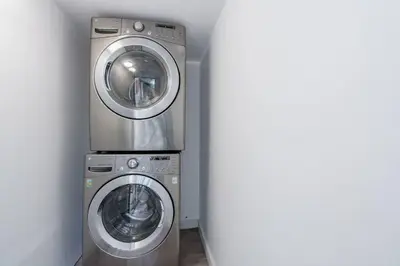 two washing machines sitting next to each other in a room at New! Miami & Calle Ocho Simpson's Funhouse! in Miami
