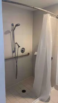 a shower with a shower curtain in a bathroom at Luxury Miami Beach Retreat, Ocean at Your Doorstep -A in Hallandale Beach
