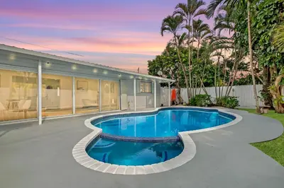 a swimming pool in the backyard of a house at Casa Azul 4Bed 2Bath Home with Heated Pool & Spa 1304 in Hollywood