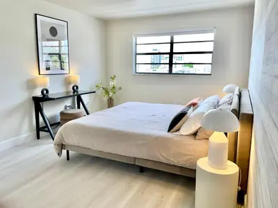 a bedroom with a bed and a window at Zen Vibe on the Beach /700 SqFt in Miami Beach