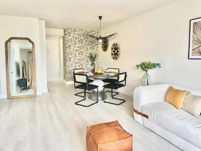 a living room with a table and a couch at Zen Vibe on the Beach /700 SqFt in Miami Beach