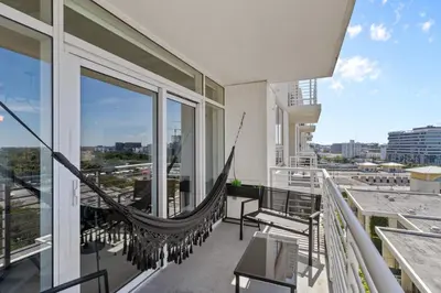a hammock on the balcony of a building at Quiet & central Apt in Midtown Miami in Miami
