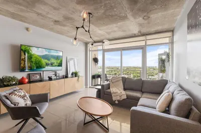 a living room with a couch and a table at Quiet & central Apt in Midtown Miami in Miami