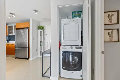 a kitchen with a washer and dryer in a room at Quiet & central Apt in Midtown Miami in Miami