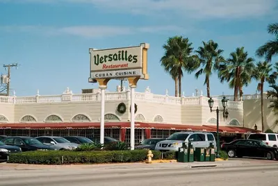 a sign in front of a car center at Apartment in Calle Ocho a Slice of Little Havana in Miami