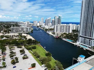 a view of a river in a city with tall buildings at Beachfront Miami Apartment with Full Kitchen -A in Hallandale Beach
