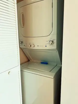 a microwave sitting on top of a white refrigerator at Beachfront Miami Apartment with Full Kitchen -A in Hallandale Beach