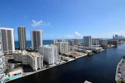 an aerial view of a city with a river and buildings at Beachside Studio, Sleep 4 Comfortably in Hallandale Beach
