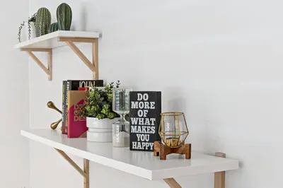 a shelf with books and other items on it at Charming Apartment near Las Olas Blvd in Fort Lauderdale