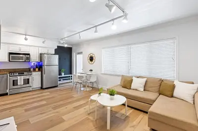 a living room with a couch and a table at Charming Apartment near Las Olas Blvd in Fort Lauderdale