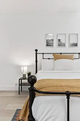 a bedroom with a black and white bed and a table at Las Olas Blvd Exclusive Apt with waterview in Fort Lauderdale