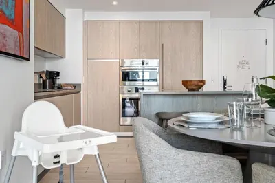 a kitchen with a table and chairs in a room at Oceanview 2BR and luxury amenities at Hyde Beach House in Hollywood