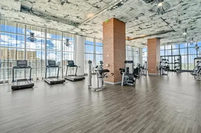 a gym with treadmills and exercise equipment in a building at Oceanview 2BR and luxury amenities at Hyde Beach House in Hollywood