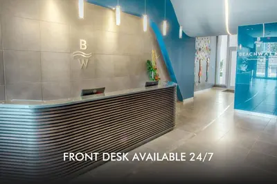 a lobby with a front desk in a building at Compact & Comfy, BeachWalk Studio for Small Groups in Hallandale Beach