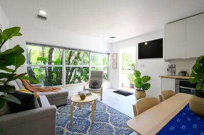 a living room with a couch and a table at Bright & Comfortable Apt in Victoria Park in Fort Lauderdale