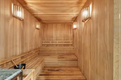 an empty sauna with wooden walls and wood flooring at Amazing 2 Bedroom Unit In Doral Miami With Free Parking in Hialeah Gardens