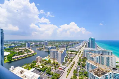 an aerial view of a city with a river and buildings at Ocean & City Views l Luxury Beachfront Condo in Hollywood