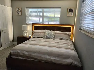 a bedroom with a large bed and a window at The Perfect Vacation Getaway ! in Miami