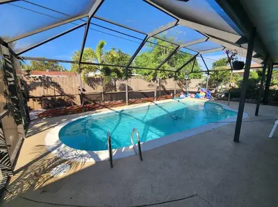 a large swimming pool with a clear cover over it at The Perfect Vacation Getaway ! in Miami
