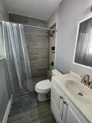 a bathroom with a toilet and a shower and a sink at The Perfect Vacation Getaway ! in Miami