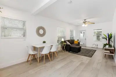 a living room with a table and a couch at Dreamy 1-bedroom apt walking distance to Las Olas in Fort Lauderdale