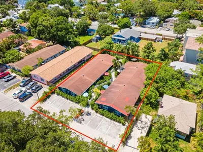 an aerial view of a parking lot with houses at Lovely 2 BR condo with free parking on premises in Fort Lauderdale