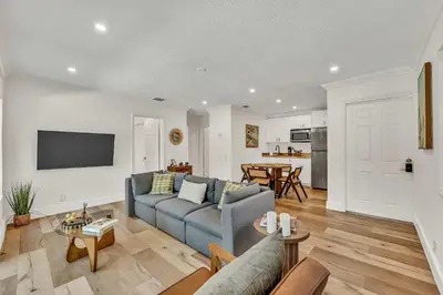 a living room with a couch and a table at Beautiful 2 BR Apartment - Bright and Spacious in Fort Lauderdale