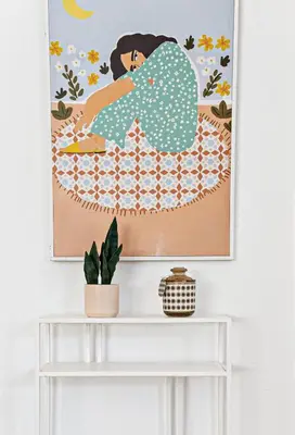 a painting of a woman lying on a bed at Stylish 2 BR condo - close to Riverwalk in Fort Lauderdale