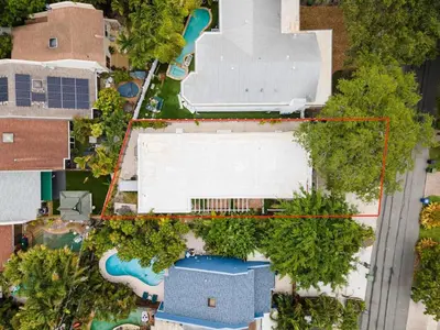 an aerial view of a resort with a pool and a building at Lovely Studio in the Heart of Victoria Park in Fort Lauderdale