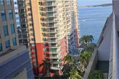 an aerial view of a tall building with the ocean at Club at Brickell Bay Bayview Balcony 1BR Free Parking in Miami