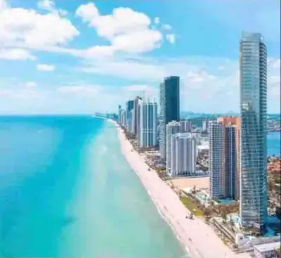 a view of a beach with buildings and the ocean at Entire Condo in Sunny Isles in Sunny Isles Beach