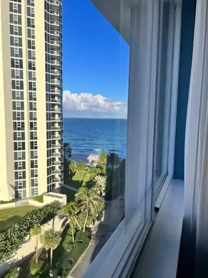 a window view of the ocean from a hotel room at Entire Condo in Sunny Isles in Sunny Isles Beach
