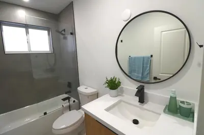 a bathroom with a white sink and a mirror at Villa Cristina in Miami in Miami