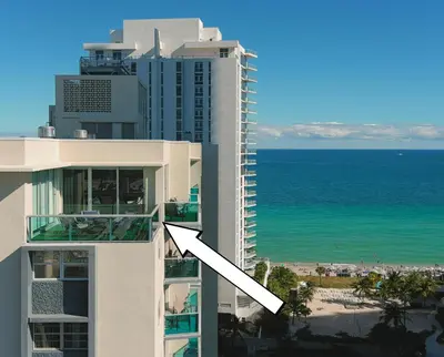 a view of a building with the ocean in the background at LUXURY PENTHOUSE ON THE BEACH 3/3 OCEANFRONT CONDO in Hollywood