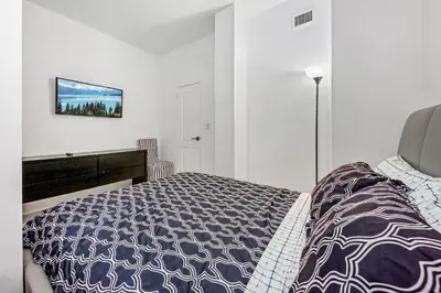 a bedroom with a bed and a desk in it at Oceanfront Luxury Penthouse On The Beach 3 Bedroom in Hollywood
