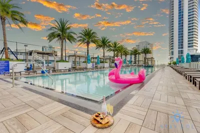 a pool at a resort with a pink swan in the water at Oceanfront Oasis, Luxury, Sunrise Views, Resort in Hollywood