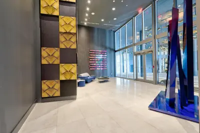 a lobby with a large wall of windows and a blue exhibit at 3900-719JC DESIGN DISTRICT, CONDO 1 BEDROOM /1 BATHROOM & BAYVIE in Miami