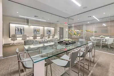 a conference room with a glass table and chairs at 805MM DOWNTOWN DORAL CONDO 2 BEDROOMS & 2 BATHROOMS in Miami
